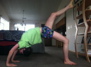 The wheel.  It's not perfect yet, but I never thought I would be able to even lift my leg off the floor when I first attempted this pose